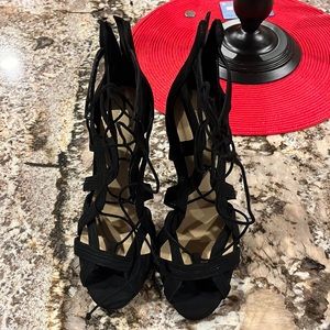 black heels; tie up in front, zip in back